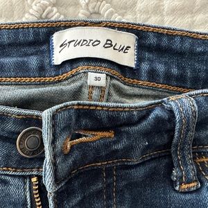 Women’s distressed dark blue jeans by Studio Blue Levi’s